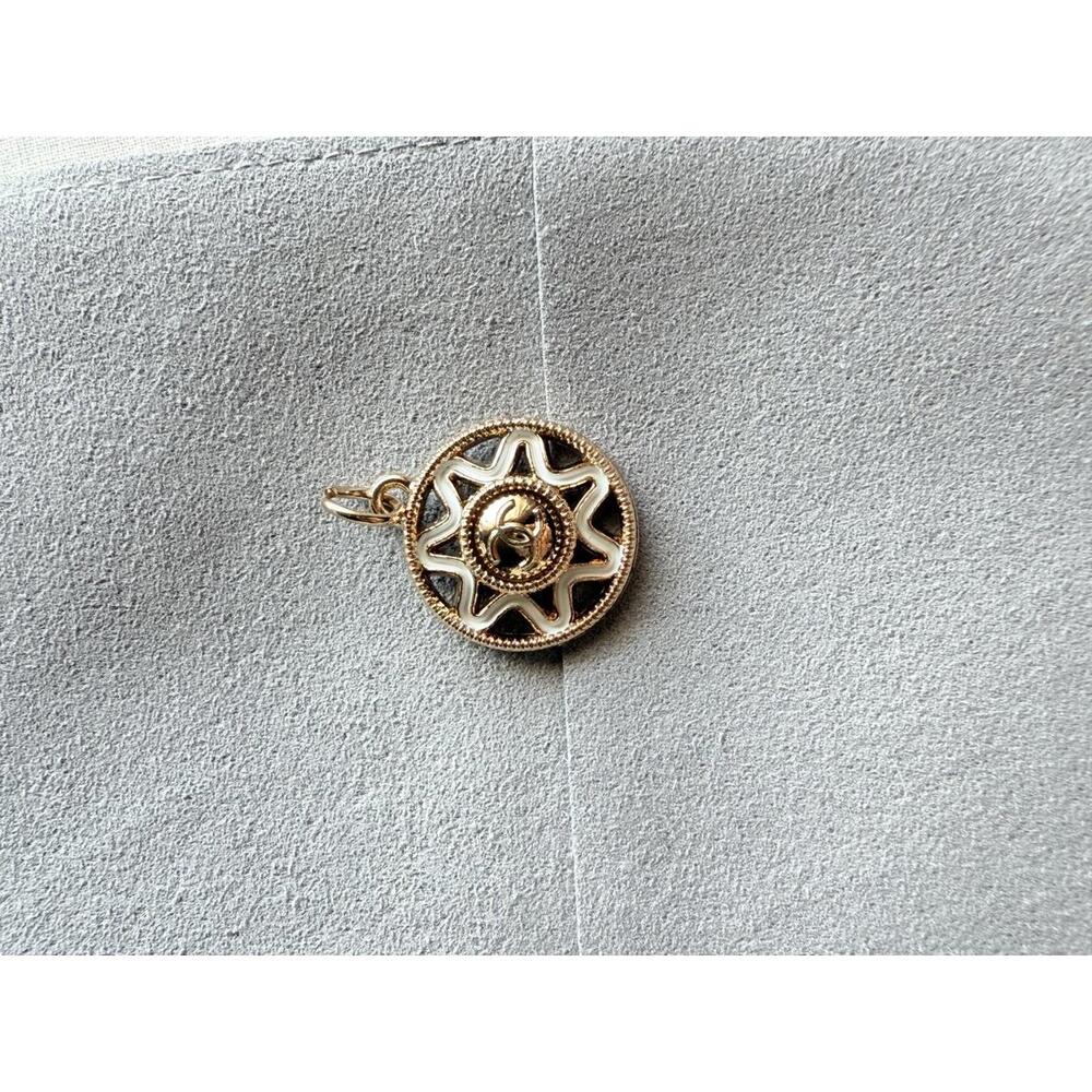 AUTHENTIC Chanel Gold-Tone Sun Motif zipper pull